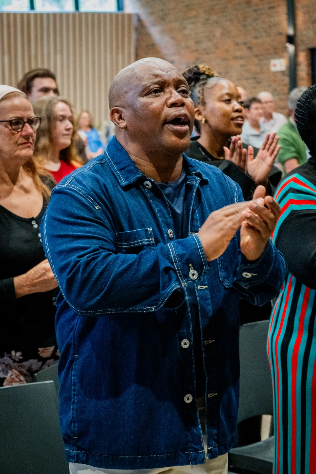Church members sharing a conversation after a gathering